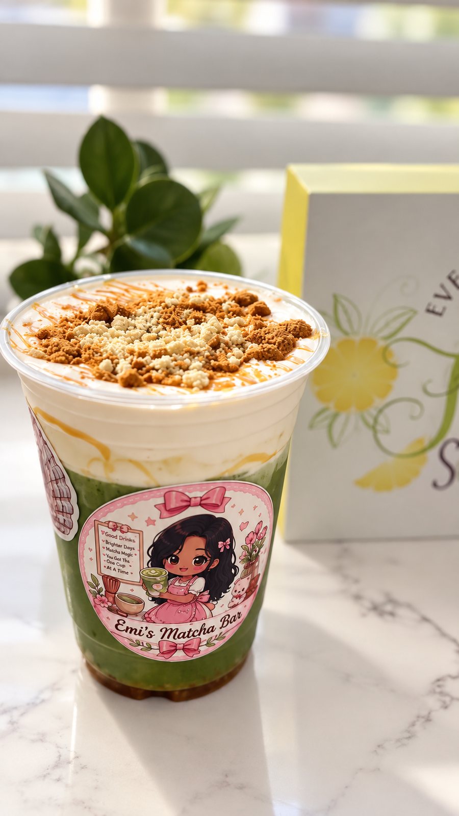 Iced matcha with a thick layer of cold foam, caramel and cookie crumble on top